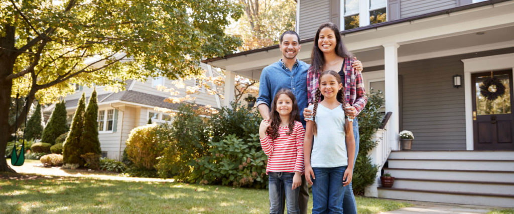 Clients standing in front of a house